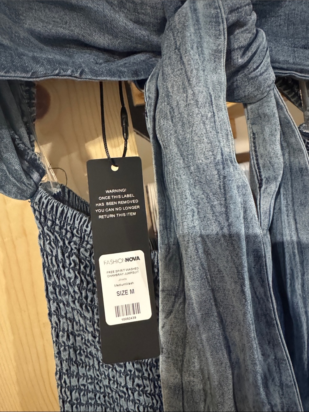 Fashion Nova Blue Chambray Smocked Jumpsuit with Tie Detail - Picture 2 of 3